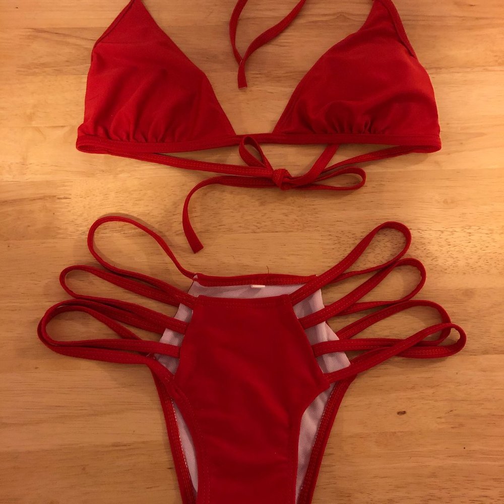 red 2 piece bathing suit w cut-out bottom size S.